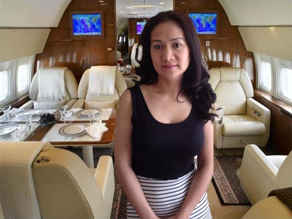 Rich Chinese woman in a private jet