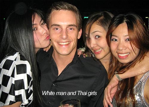 White man and Thai girls