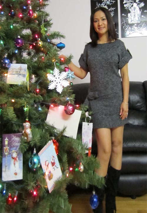 Singaporean woman n Christmas tree